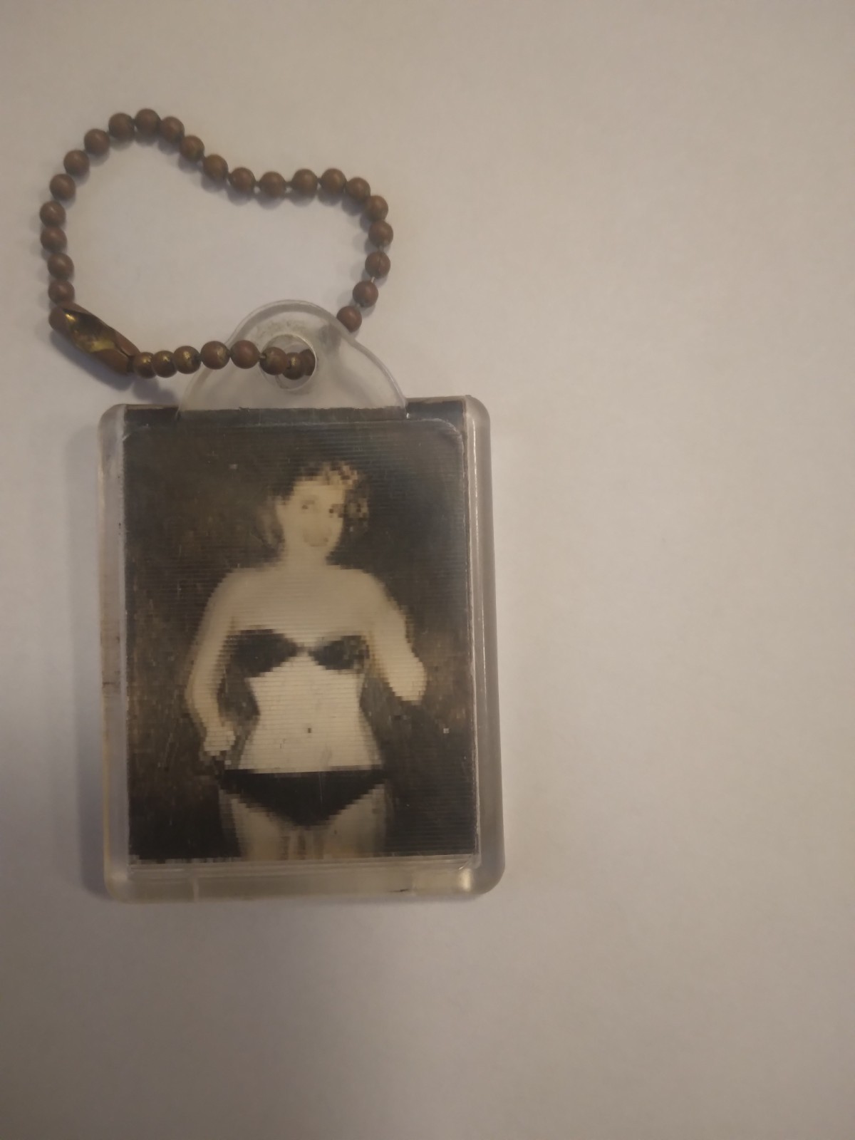 This is a Vintage Keychain with a movable, dancing, photo This is a Vintage Keychain with a movable, dancing, photo