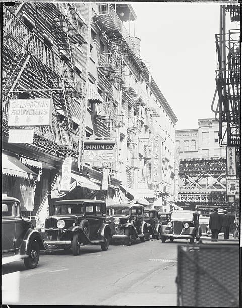 Automobiles line the narrow streets of Chinatown in Manhattan 1934 Old Photo
