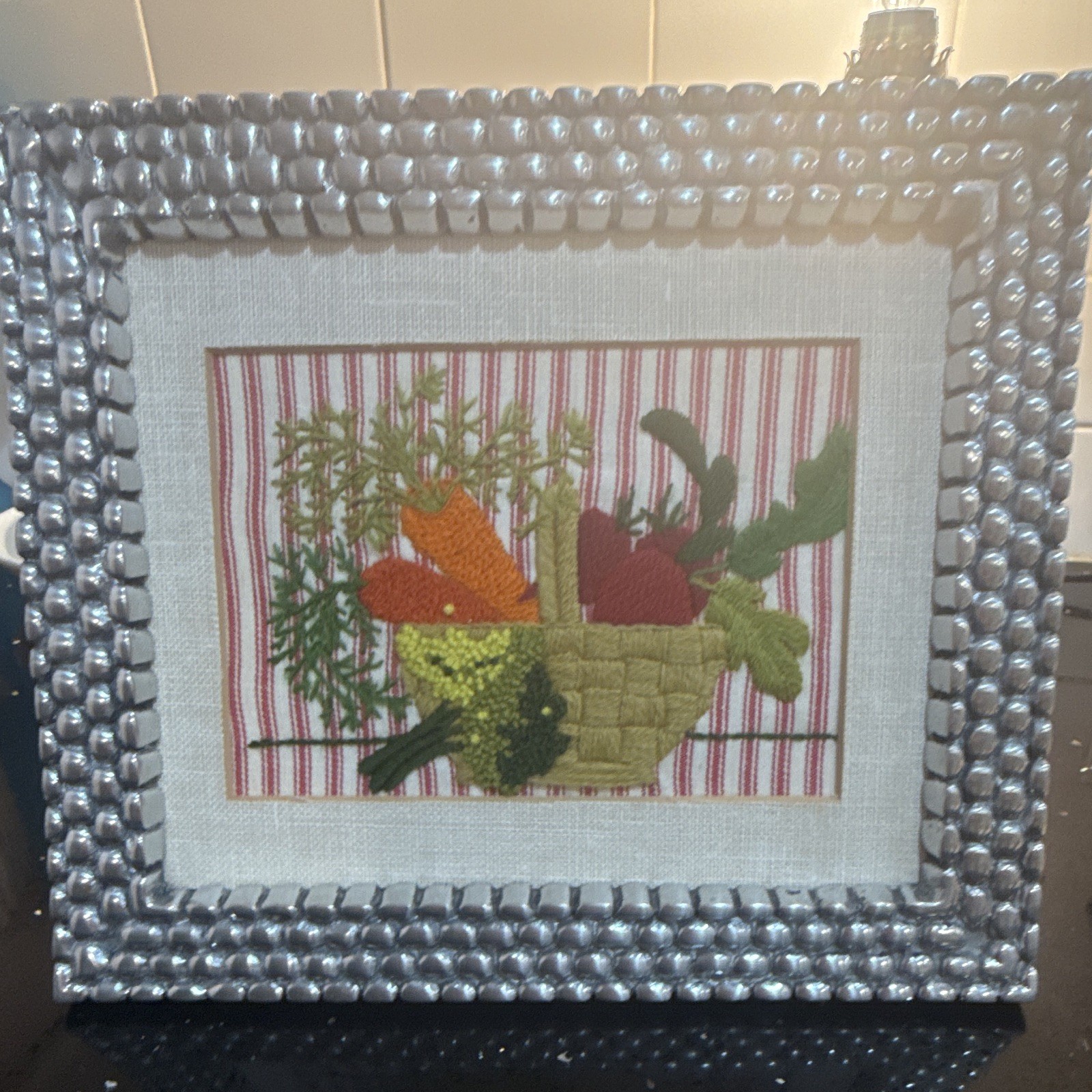 Very heavy pewter frame. Wood backing