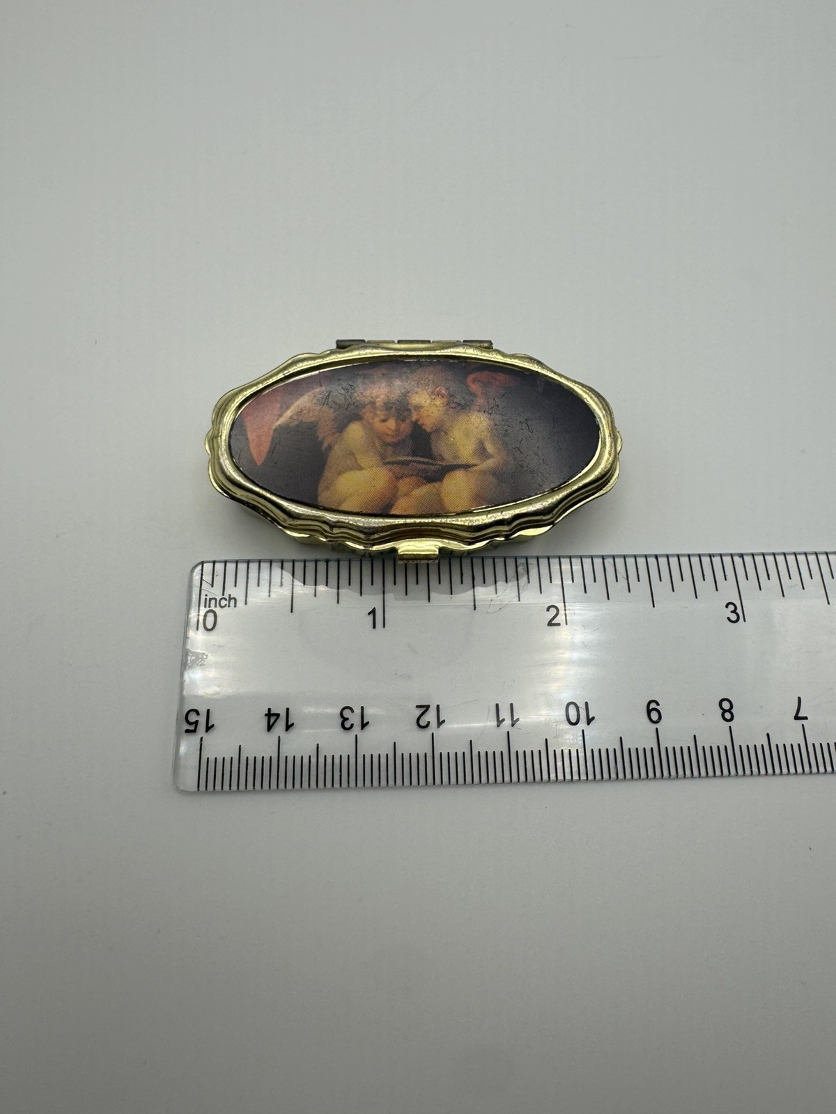 Vintage Gold Tone Pill / Trinket / Sewing Kit Box with Cherubs / Angels