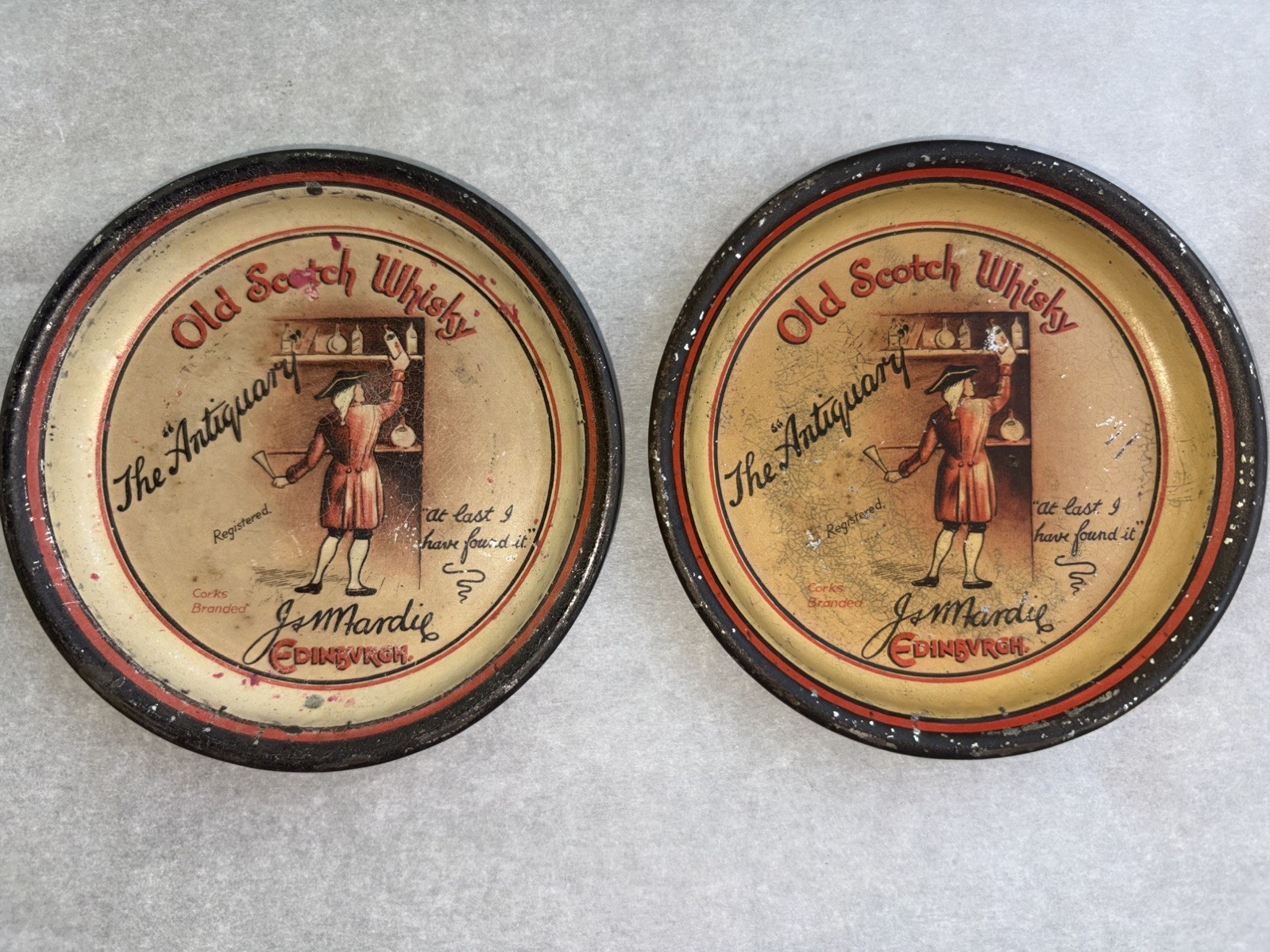 2-VERY RARE  PRE PROHIBITION TIP TRAYS “ OLD SCOTCH WHISKY THE ANTIQUARY” app 4”
