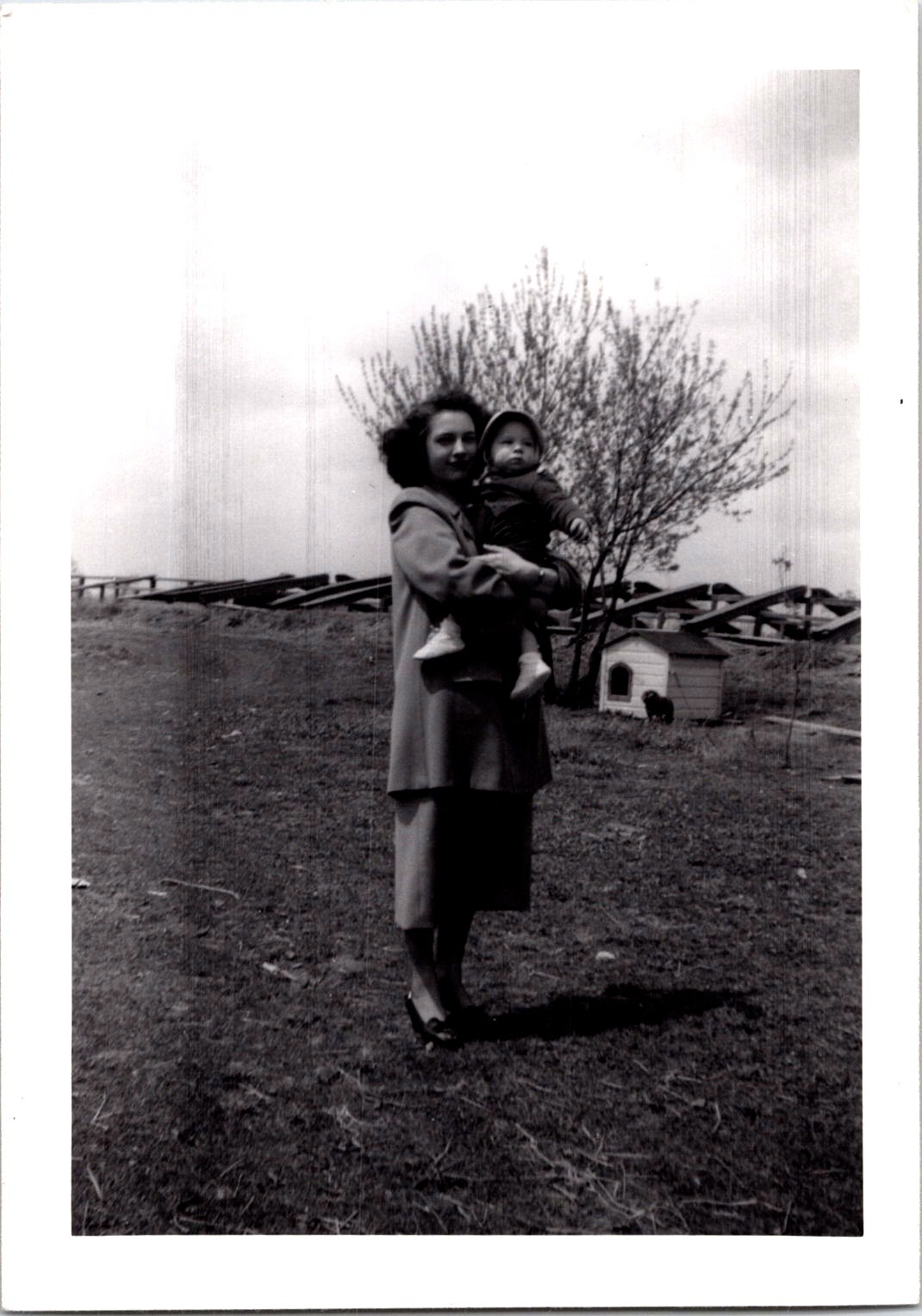 Mother Holding Baby Outdoors, 1949 B&W Vintage Snapshot Photo Mother Holding Baby Outdoors, 1949 B&W Vintage Snapshot Photo