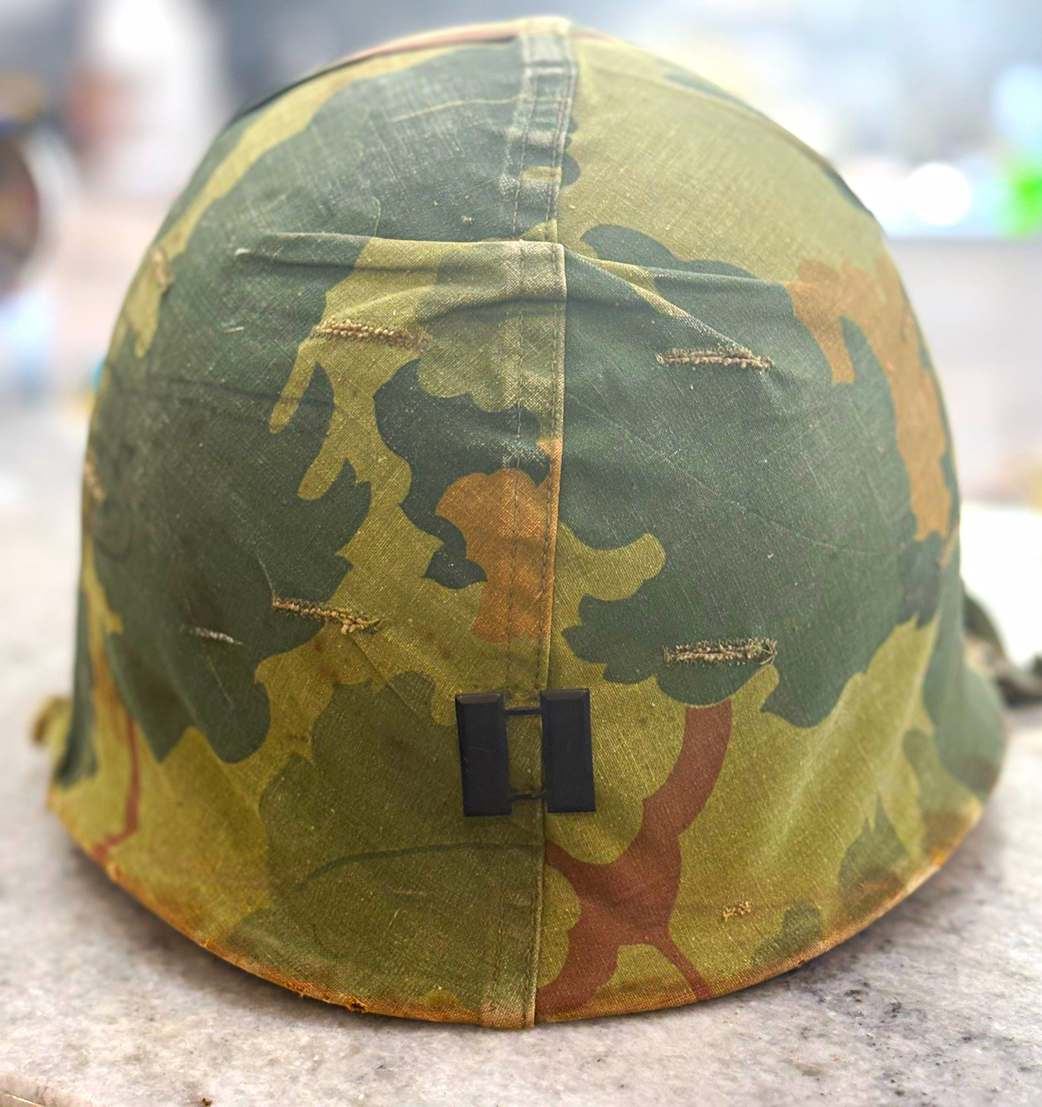 Vintage Vietnam M-1 military combat helmet with captain insignia Nam era 1960s