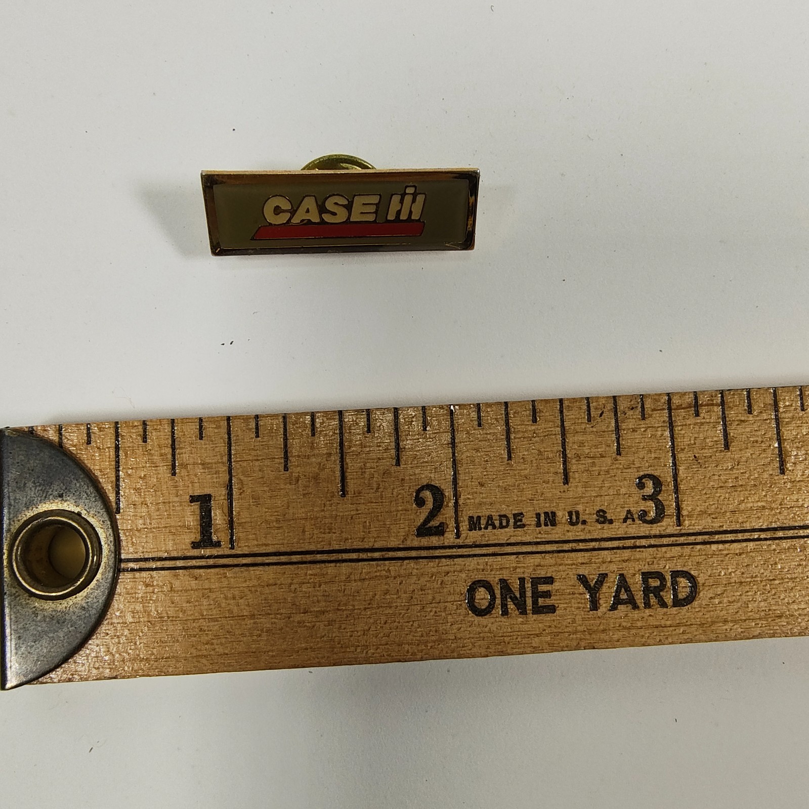 Promotional lapel pin for Case IH agricultural equipment. Promotional lapel pin for Case IH agricultural equipment.