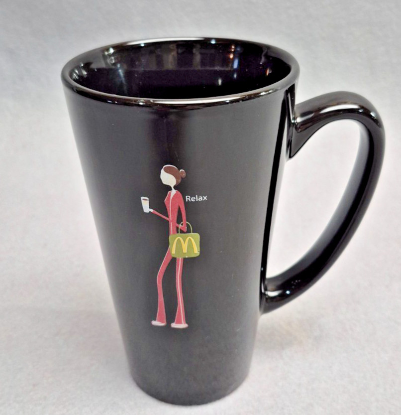 McDonald\'s Black Mug with Word Relax  and Girl Carrying McDonald\'s Bag 16 oz.