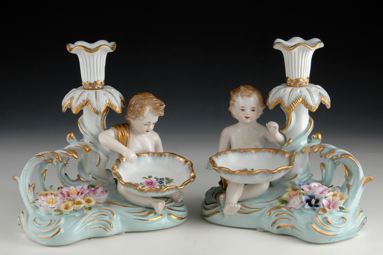 Porcelain pair of candleholders or candlesticks, Merman Children.