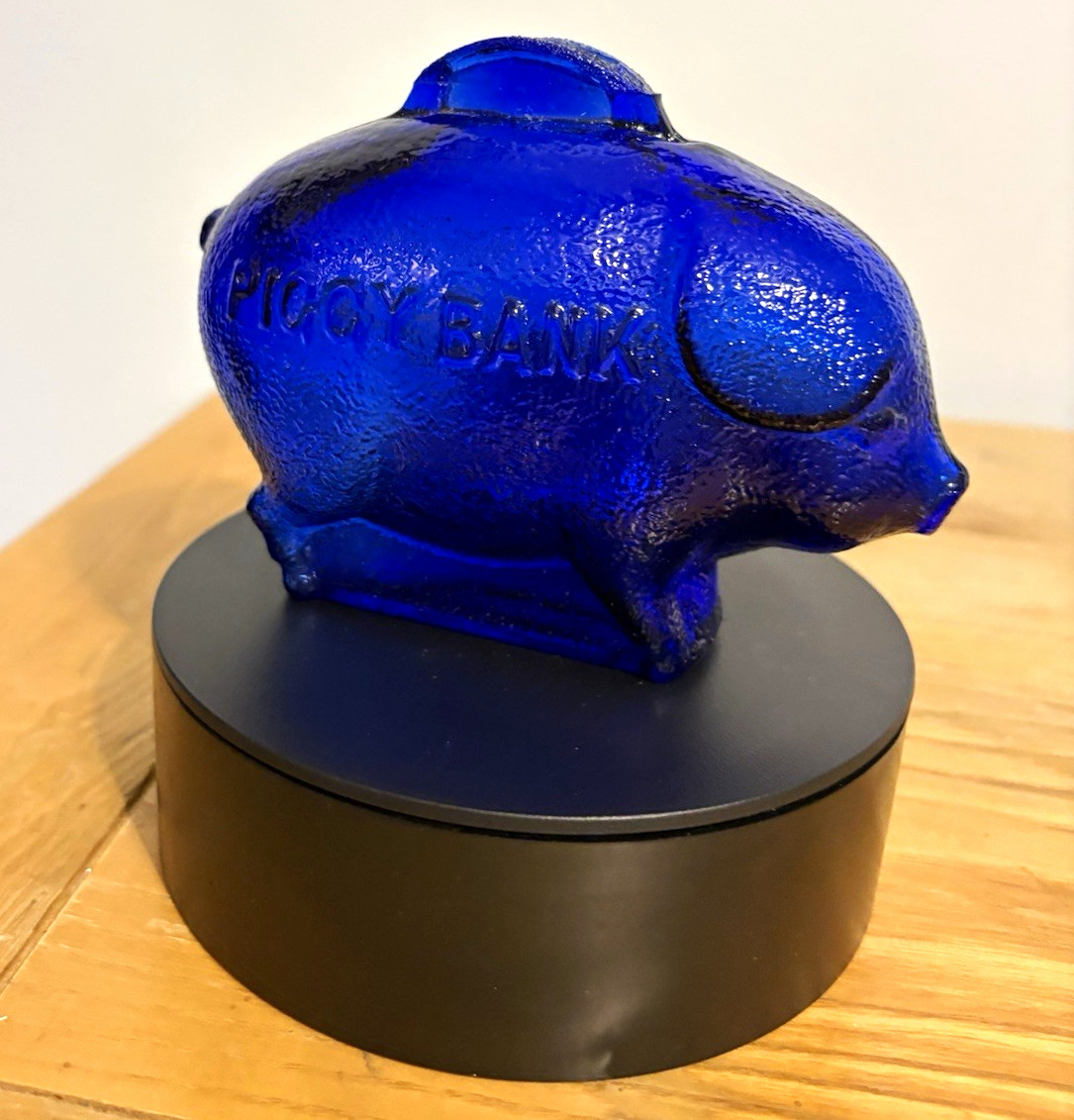 This is a vintage cobalt blue textured glass piggy bank.