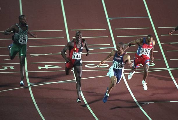 Maurice Greene of USA sticks tongue out as he celebrates victory 1- Old Photo