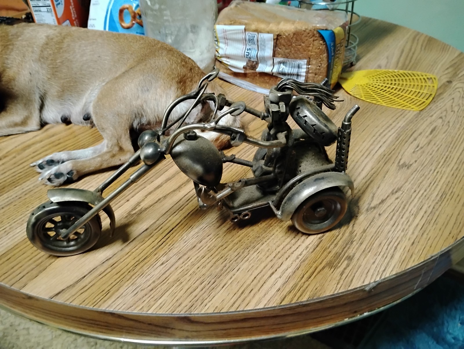 3-wheeled chopper motorcycle featuring welded nuts, bolts, recycled metal parts. 3-wheeled chopper motorcycle featuring welded nuts, bolts, recycled metal parts.
