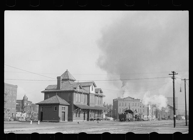 Photo:Unknown City 1930s Railroad Depot Street Steam Locomotive Buildings