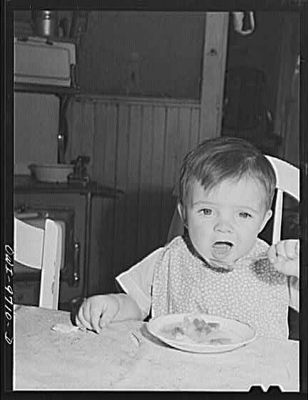 1900s Toddler Eating at Table Vintage Black and White Family Snapshot