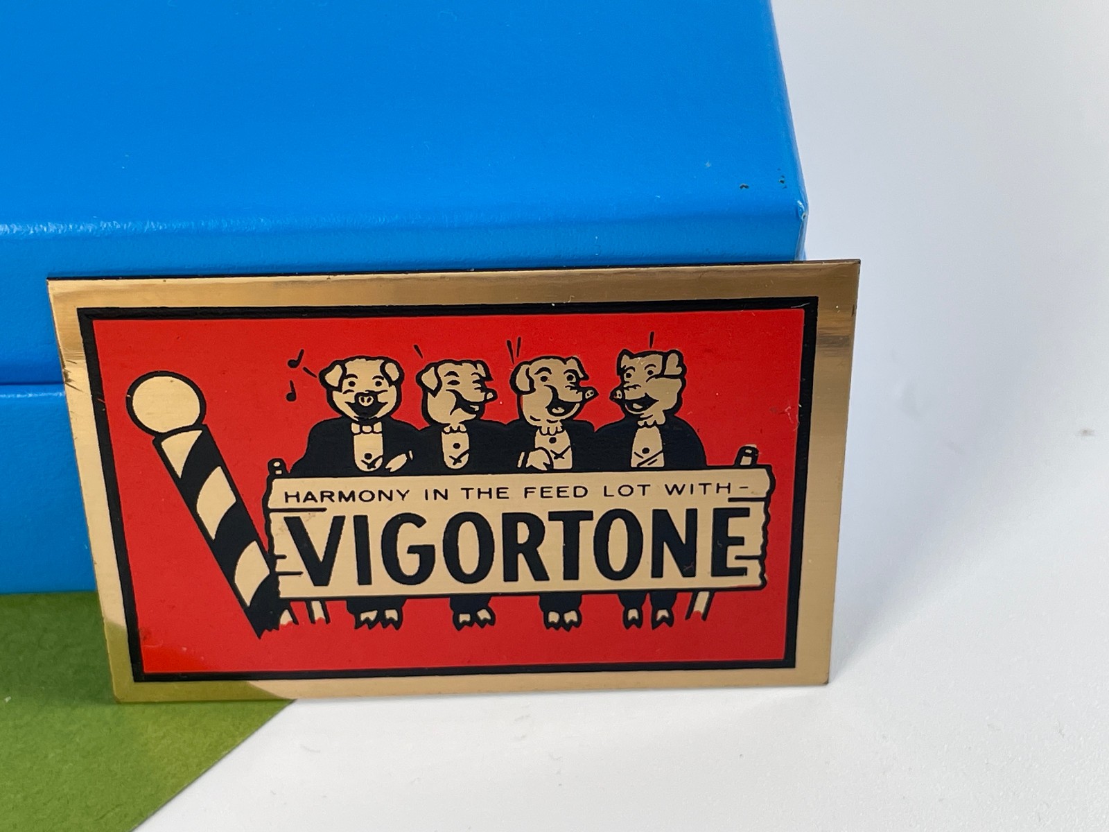 Vintage Advertisement Brass Plaque Plate VIGORTONE Harmony in the Feed Lot Pigs