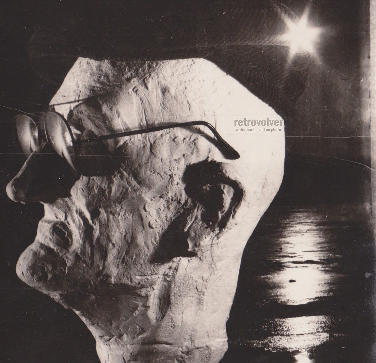 Strange Head Form Wearing Glasses Beneath Blinding Light Surreal Abstract Photo
