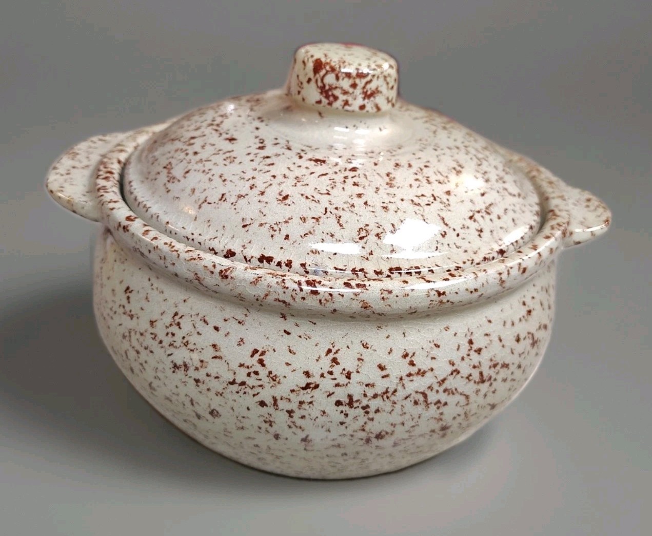 vintage Monmouth Pottery bean pot, often featuring a brown speckled or...