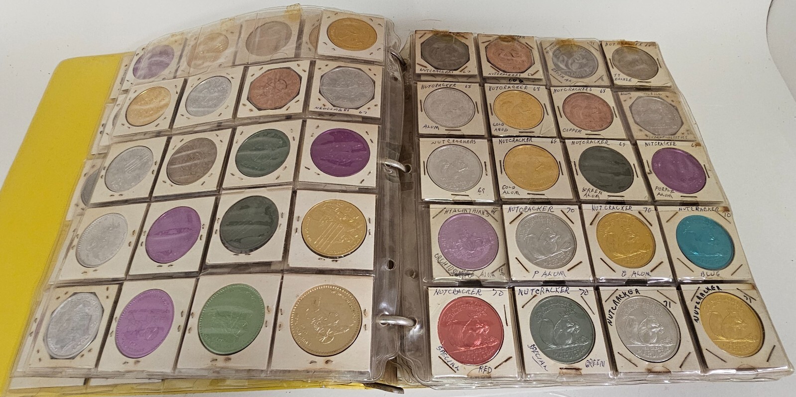 MARDI RAS DOUBLOON ALBUM CONTAINING APPROXIMATELY 273 1960-70's'S VINTAGE COINS