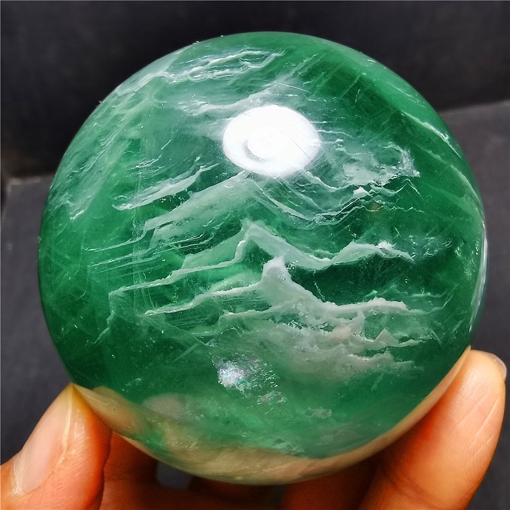 556.6G Natural Polished Apple Green Thousand Layers Fluorite ball 74A81