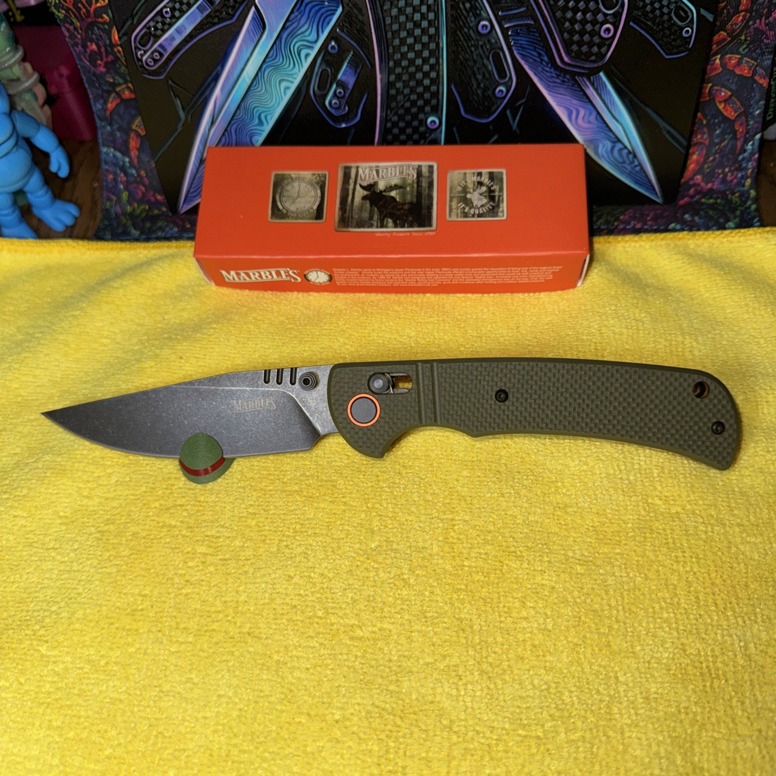 Marbles Black Stainless Steel Blade. G10 OD Green Handle. Thumb Stud. Bar Lock. Marbles Black Stainless Steel Blade. G10 OD Green Handle. Thumb Stud. Bar Lock.