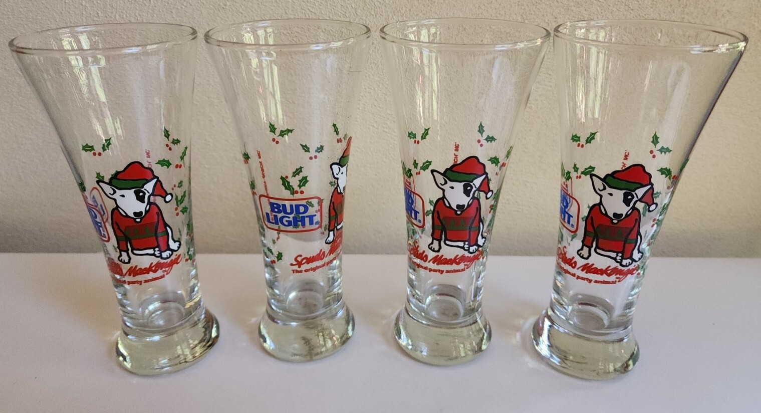 Set of 4 Vintage 1987 Spuds Mackenzie Bud Light Christmas Pilsner Beer Glasses Set of 4 Vintage 1987 Spuds Mackenzie Bud Light Christmas Pilsner Beer Glasses