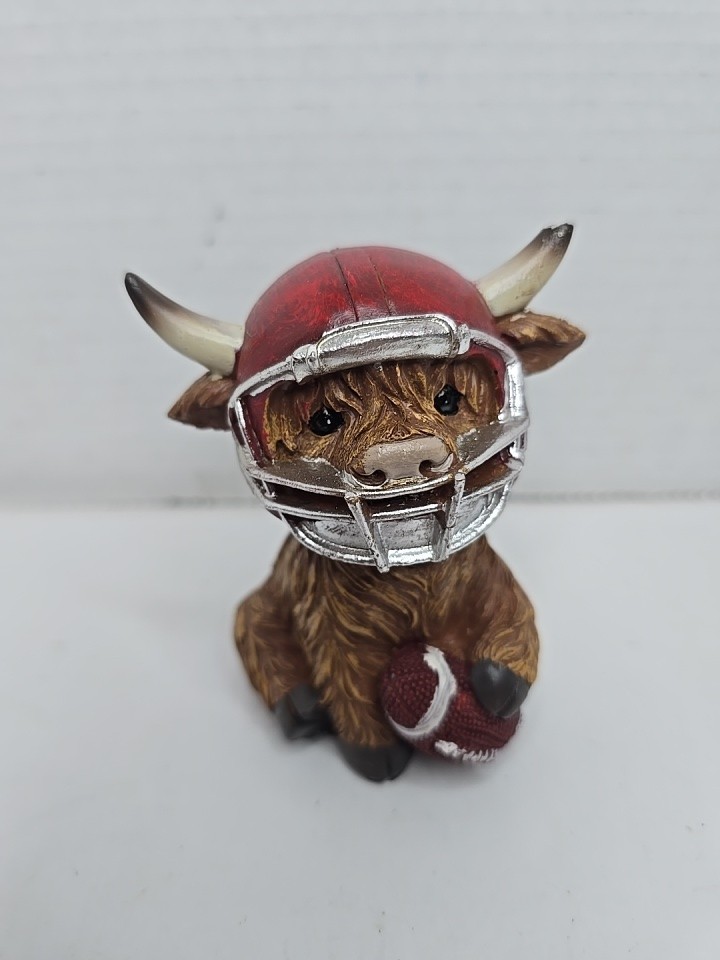 Adorable Highland Cow With Football Adorable Highland Cow With Football