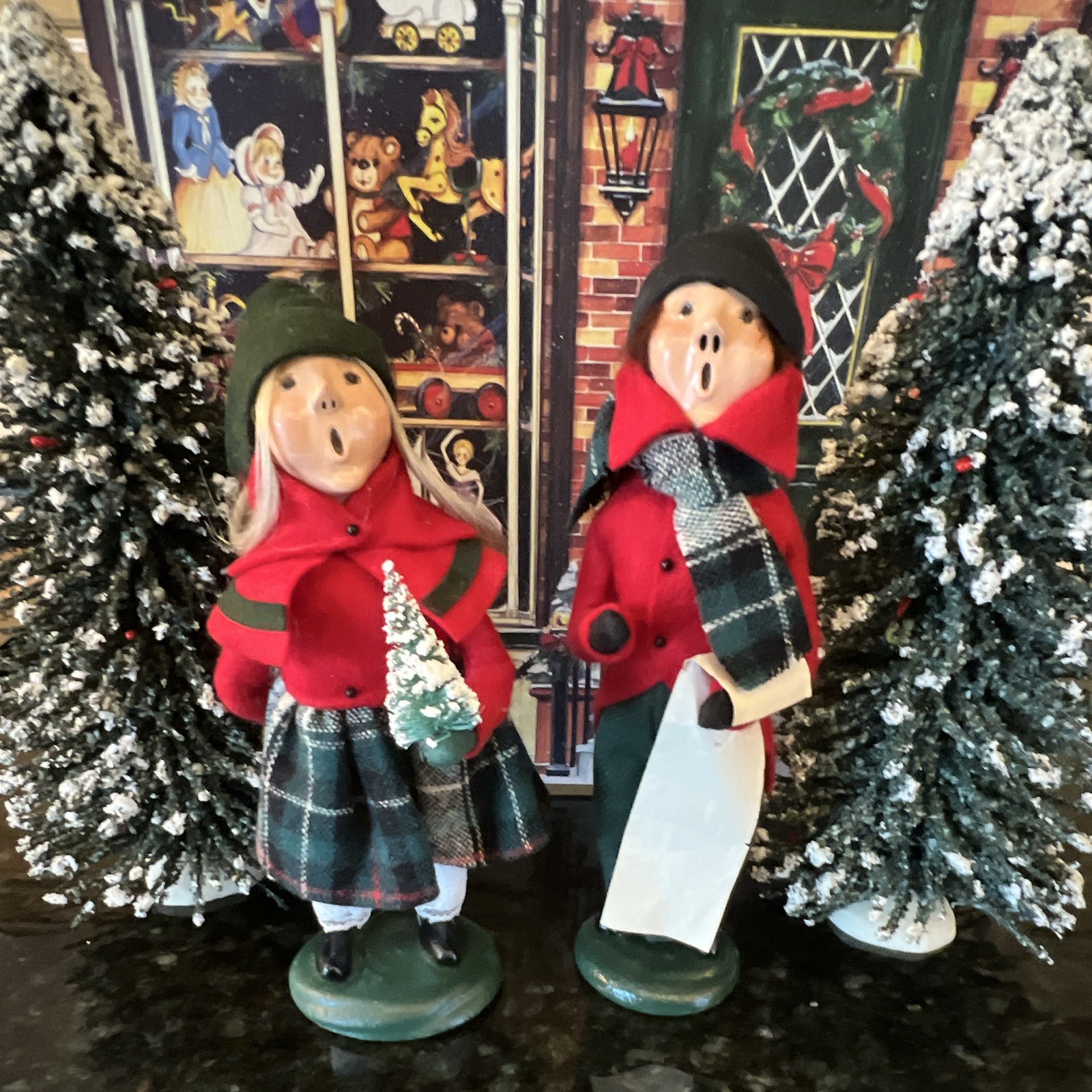 Vintage 2005 Christmas Caroler boy and girl w/ red & green outfits plaid fabric