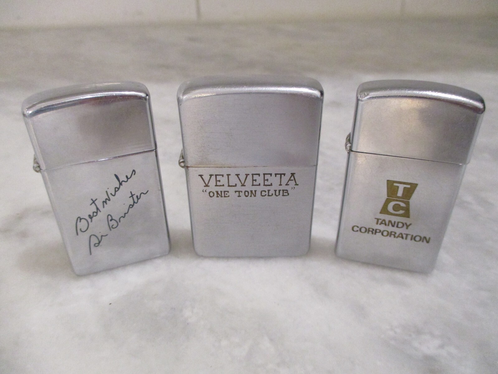 ZIPPO LIGHTERS(3) 1950s/1958/1972 -TANDY CORP(RADIO SHACK)-VELVEETA ONE TON CLUB