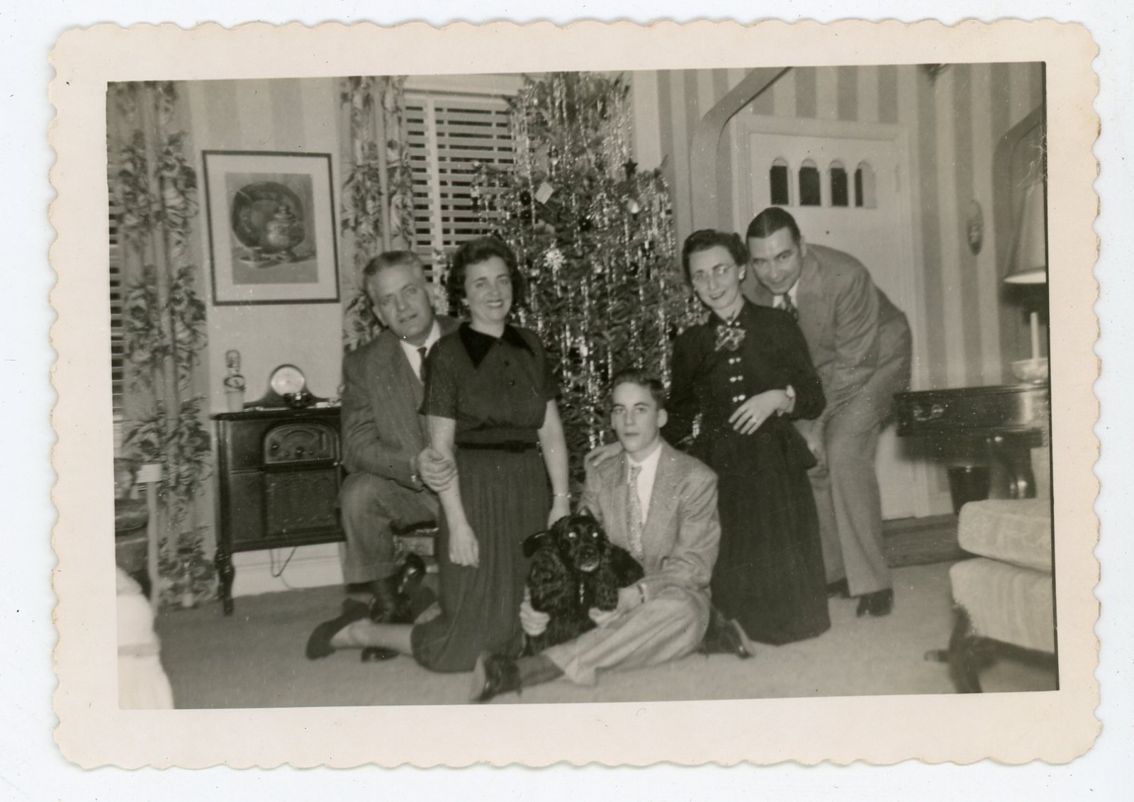 Vintage 1950 Christmas Family Photo w Dog Under Tree Mid Century Holiday Snapsho