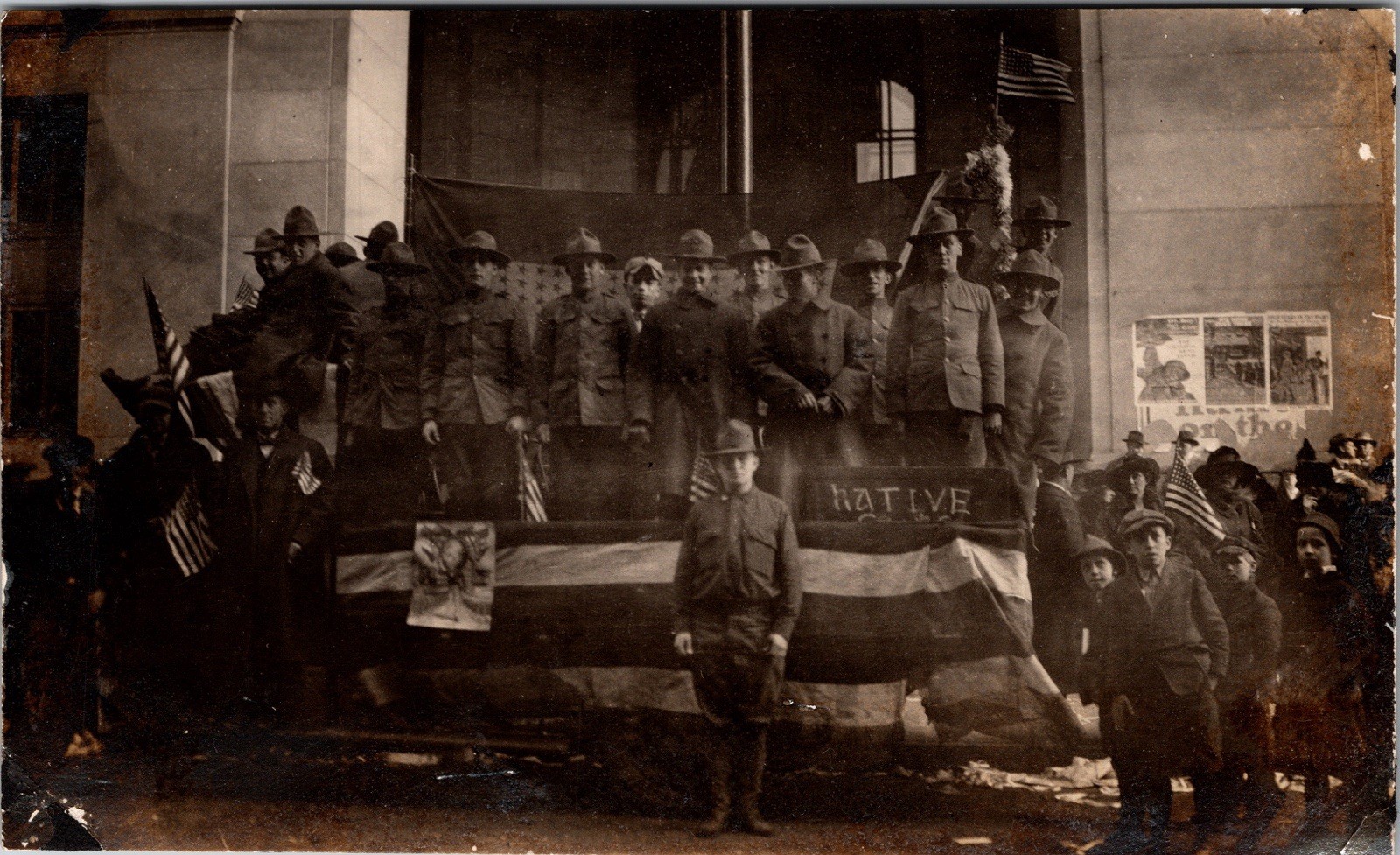 Postcard Real Photo RPPC US Army Soldiers on Stage American Flags