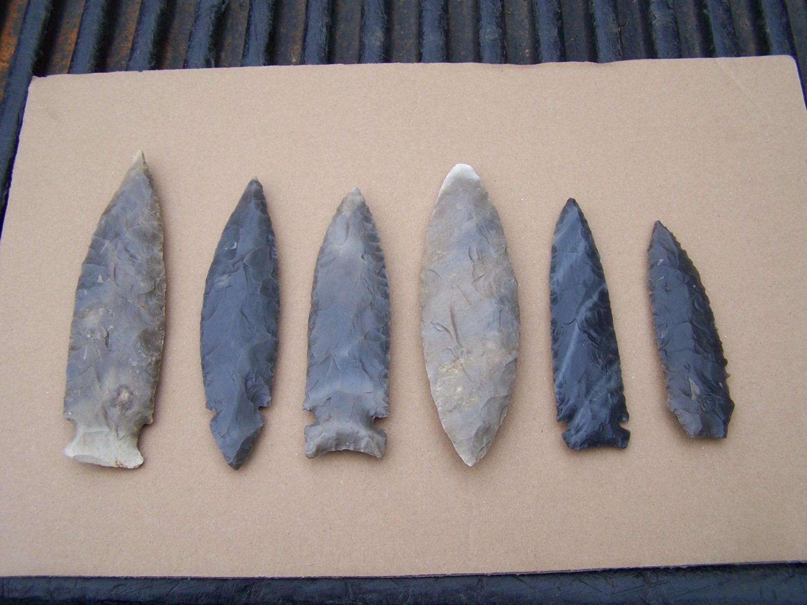 Here is a group of 6 reproduction arrowheads (Read listing)
