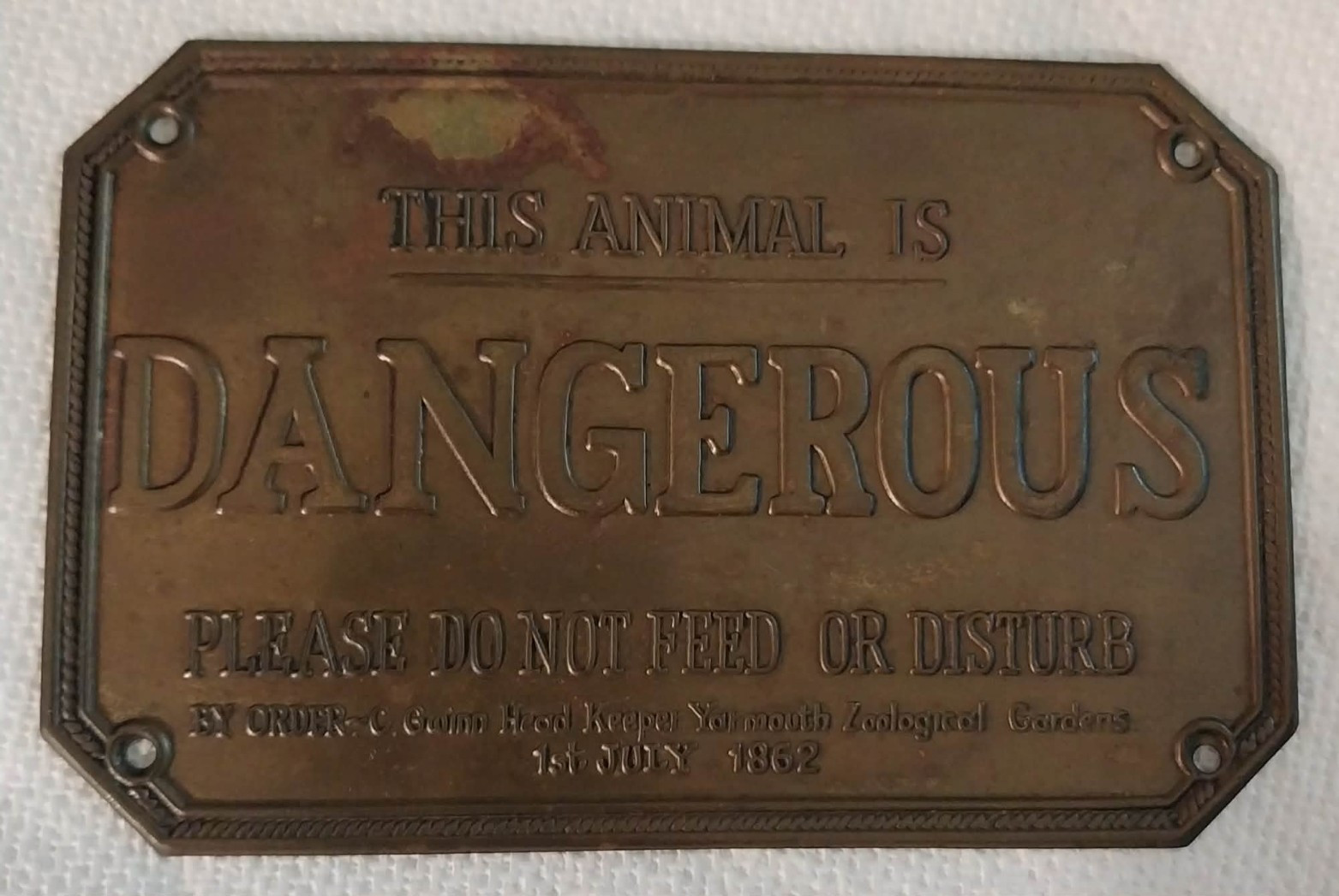 Embossed Antique Brass Tone Metal Wall Sign “This Animal Is Dangerous” Embossed Antique Brass Tone Metal Wall Sign “This Animal Is Dangerous”