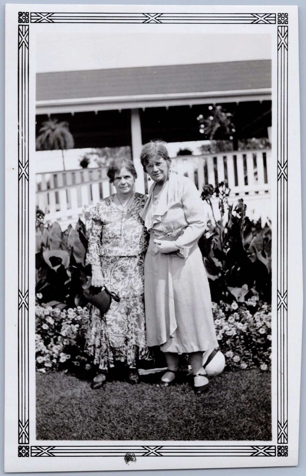 2 Older Women in Dresses Pose by Flower Garden Border 1920s-1930s Snapshot Photo