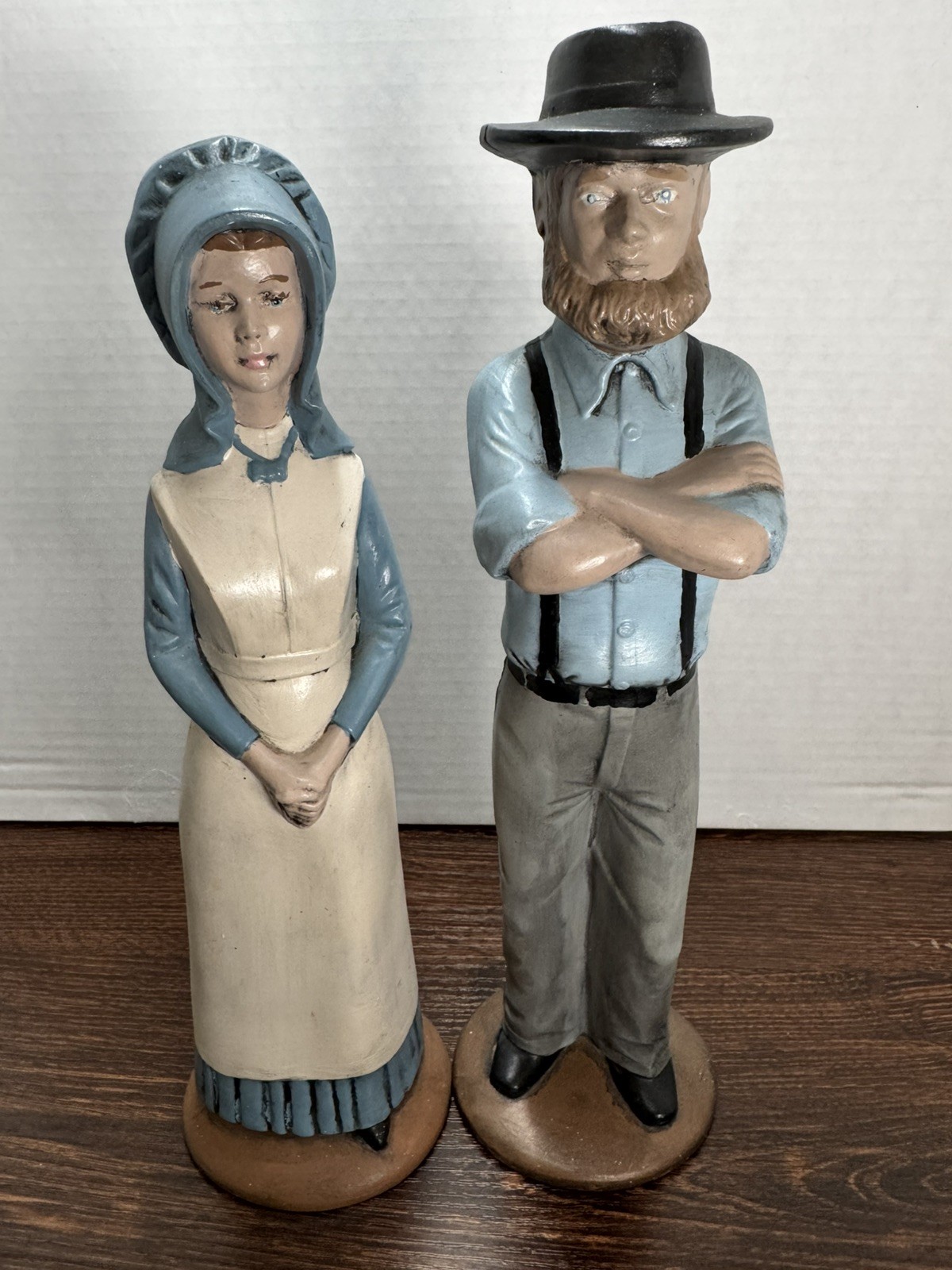 Pair of vintage hand-painted ceramic Amish couple figurines