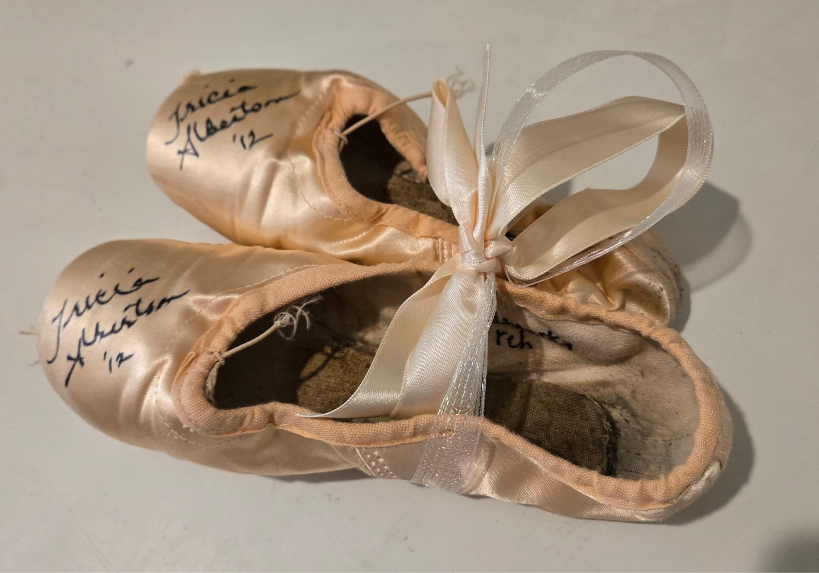 Performance worn ballet slippers signed by Prima Ballerina, Tricia Albertson