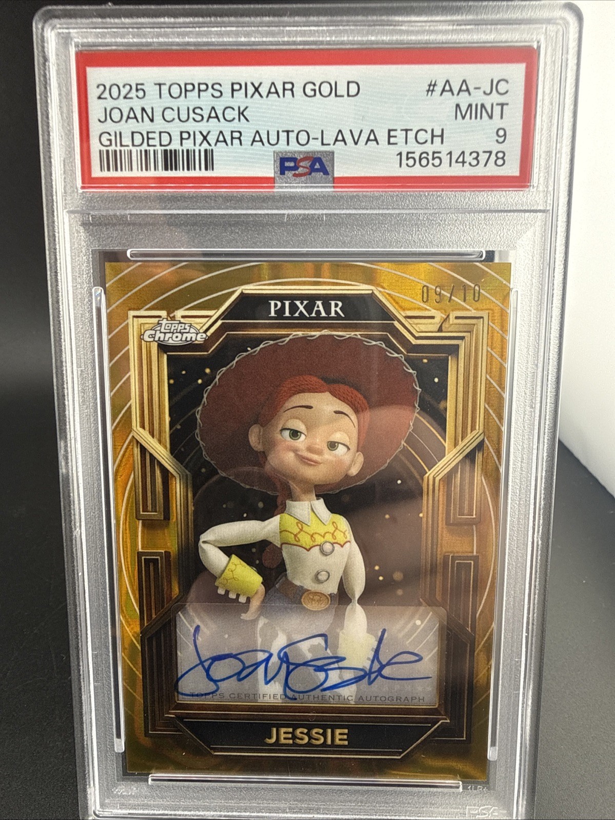 🔥2025 Topps  Pixar Gold Joan Cusack as Jessie Gilded Auto #AA-JC  /10