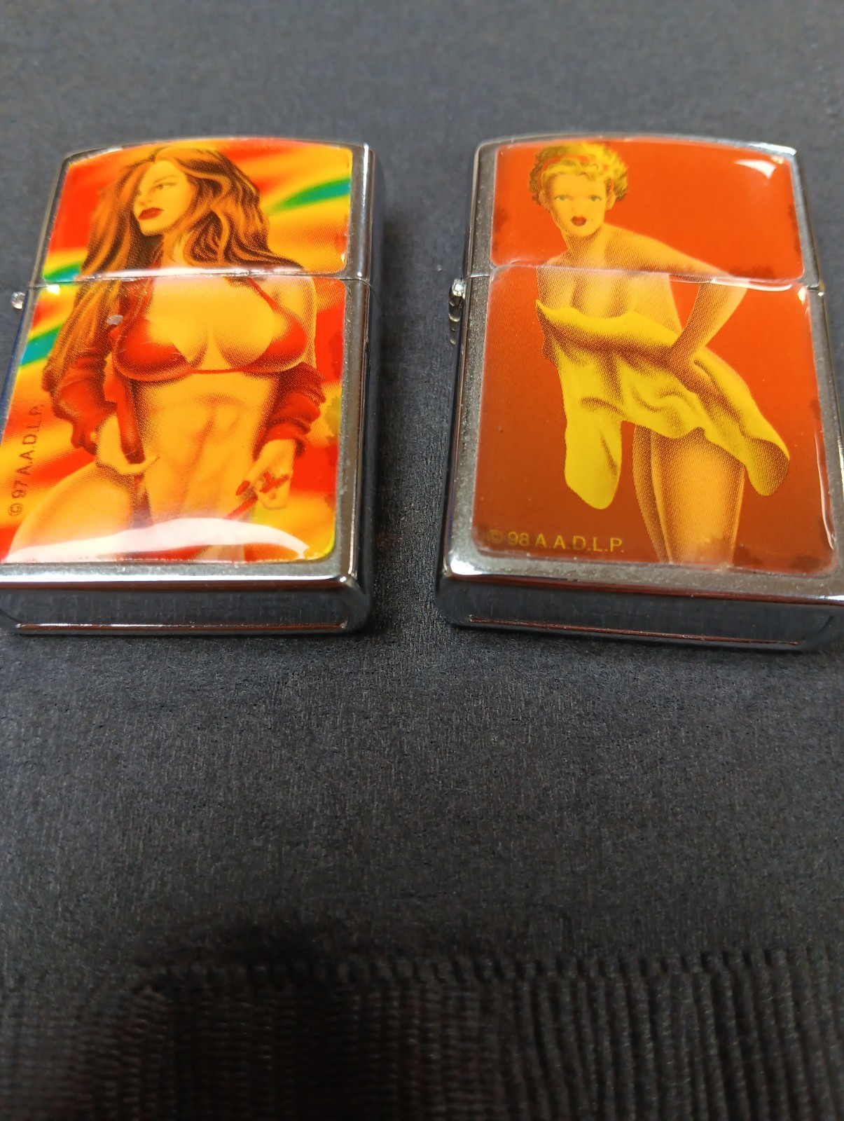 2 ORANGE YELLOW BIKINI BUSTY SEXY PINUP GIRLS  LIGHTERS MINT