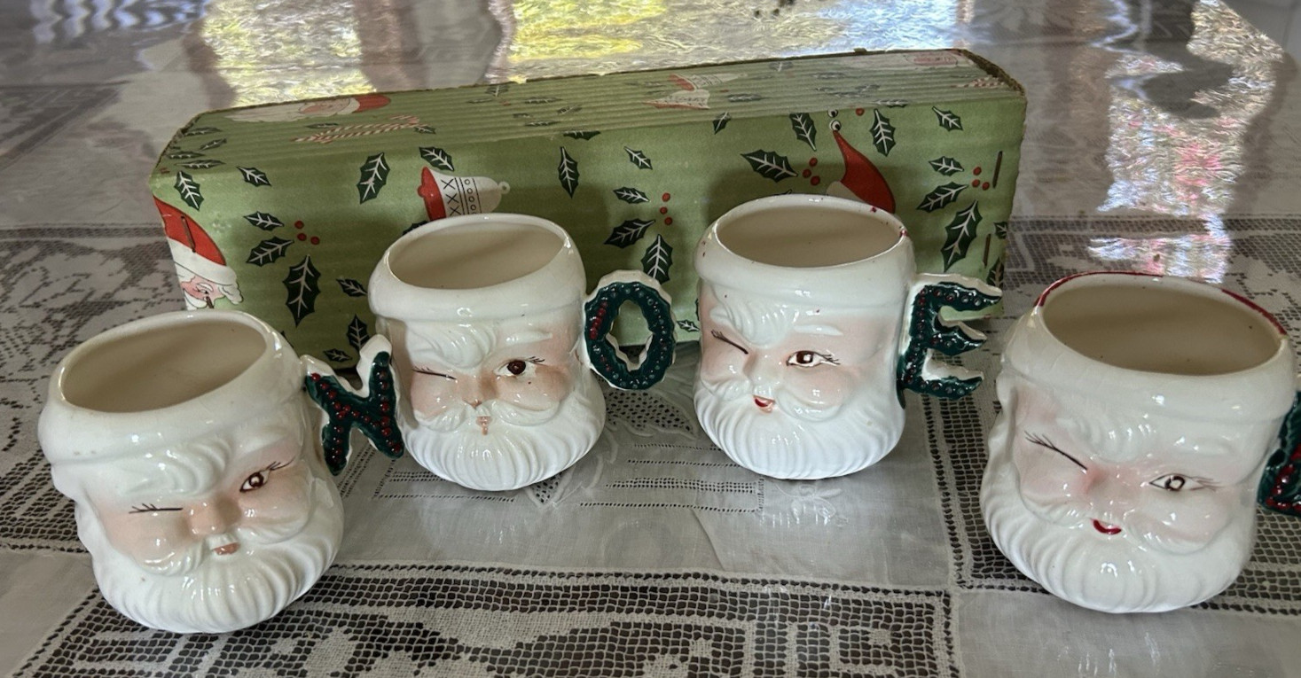 FOUR Vintage 50’s Winking Santa Christmas Mugs: handles spell NOEL Japan 1950's. FOUR Vintage 50’s Winking Santa Christmas Mugs: handles spell NOEL Japan 1950's.