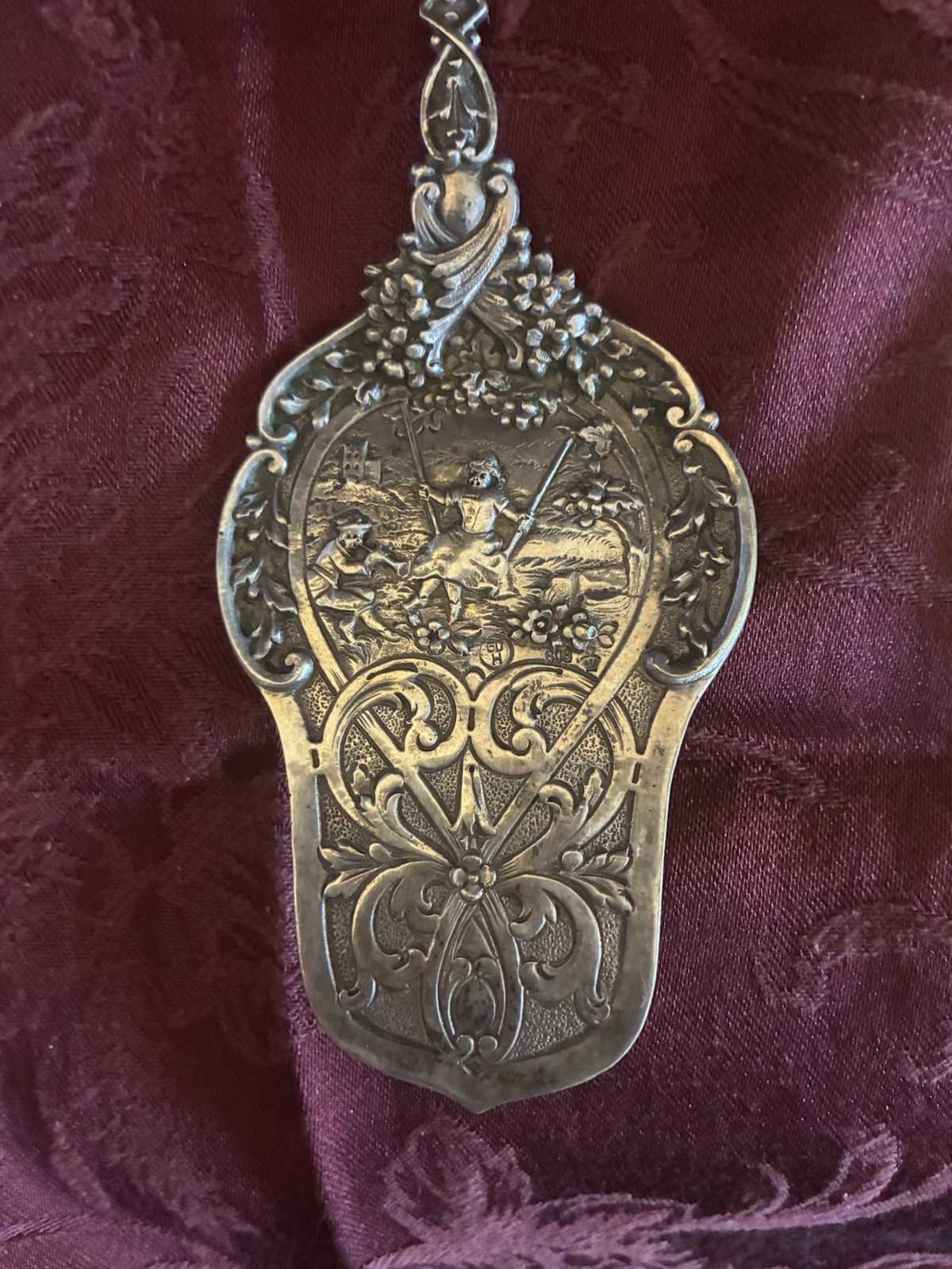 Antique German silver serving utensil with ornate design