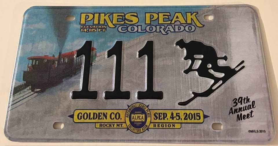 2015 Golden Pike's Peak ALPCA Souvenir License Plate 111 Train Skier Skiing