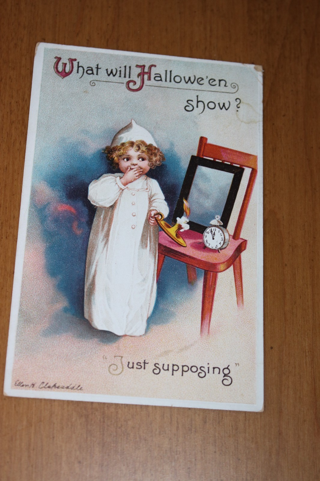 Antique Clapsaddle Halloween Postcard with girl, mirror, candle clock 