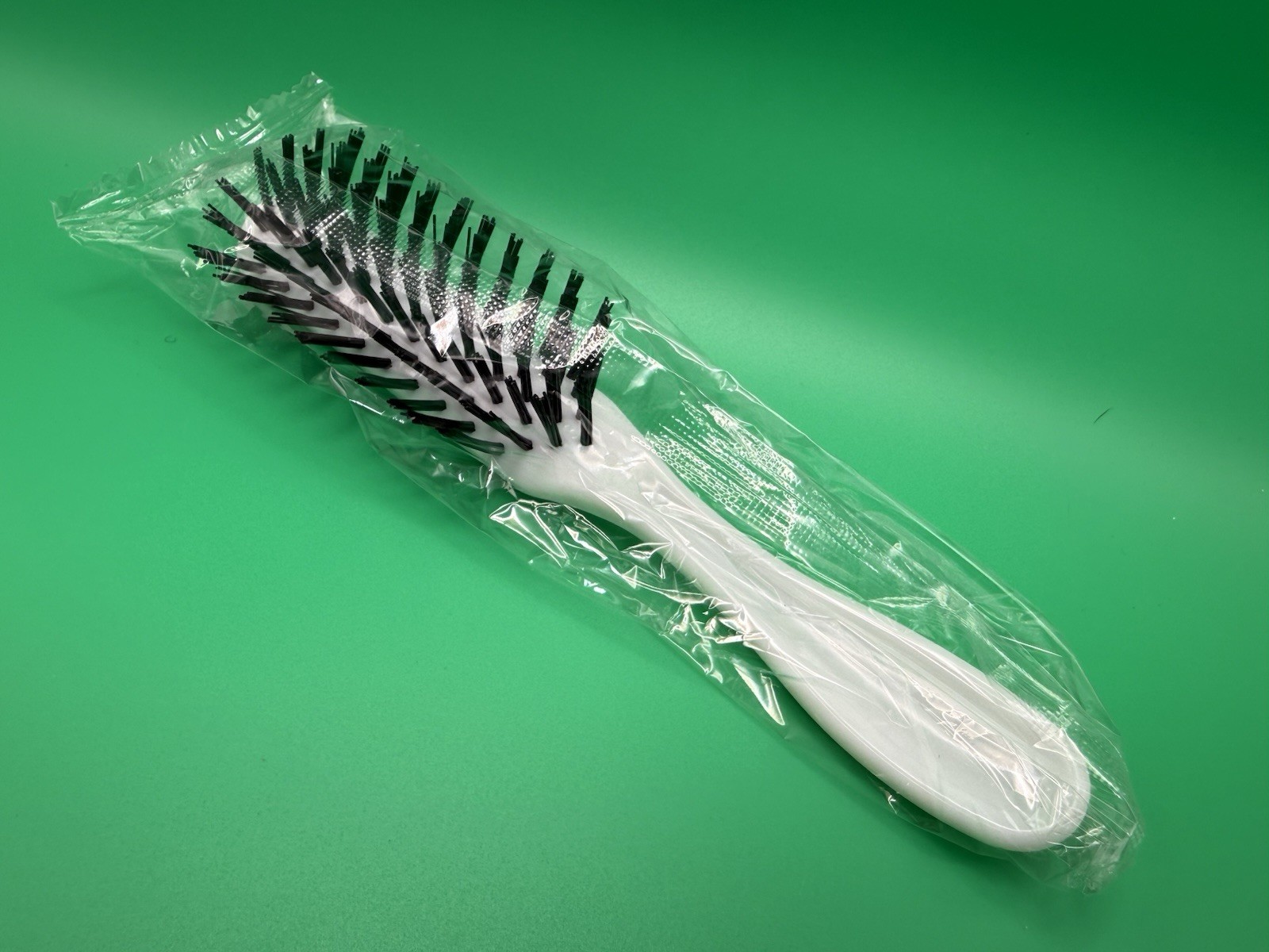 New Vintage White Plastic 7” Hairbrush With Black Nylon Bristles