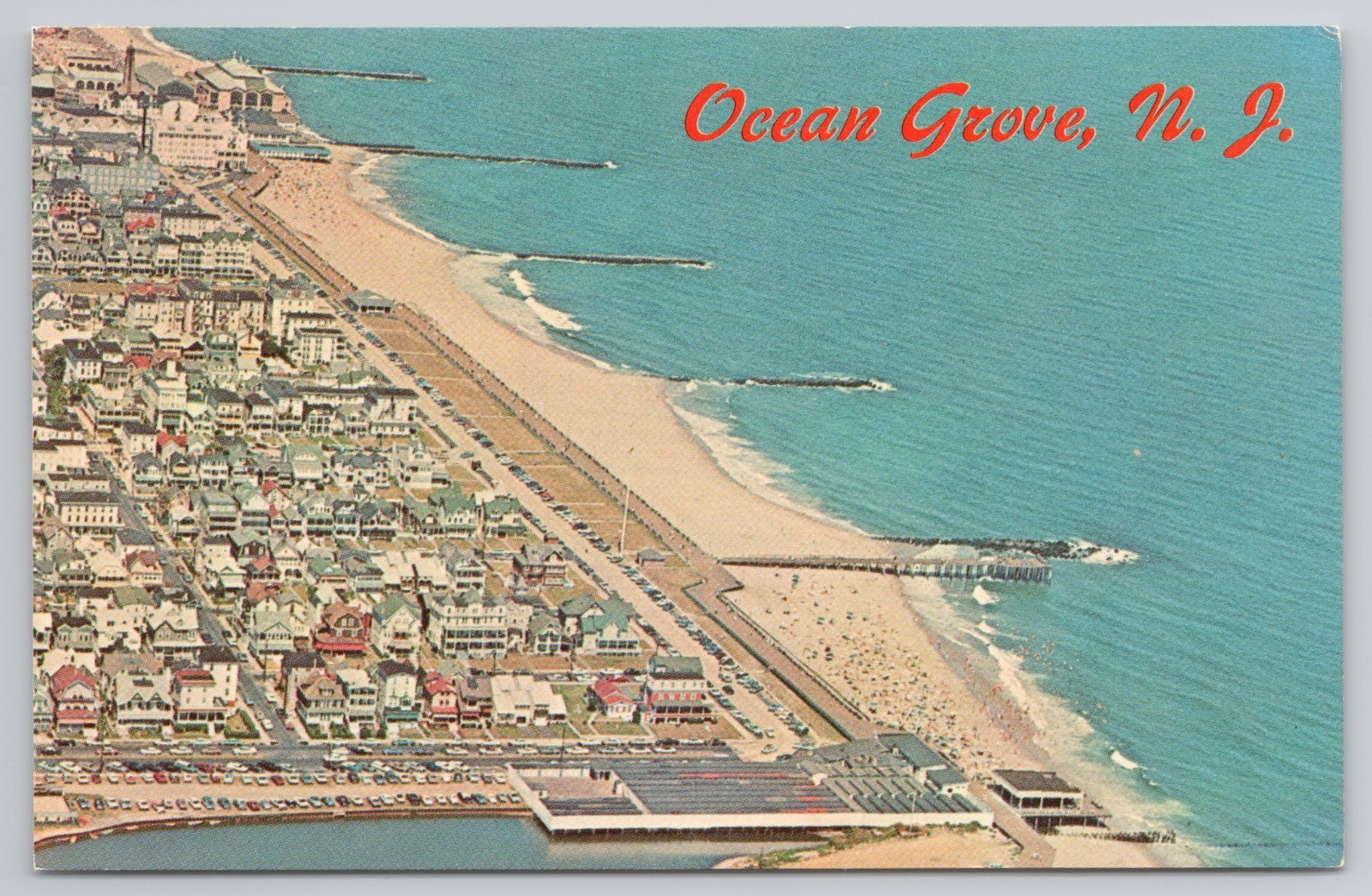 Postcard Aerial view of the beach front and boardwalk AT OCEAN GROVE, N. J.