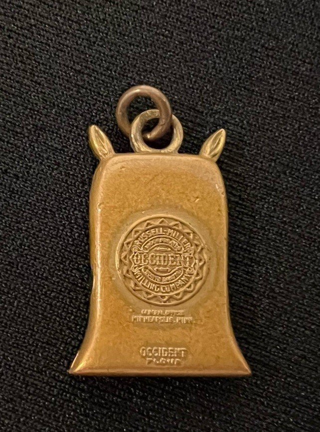 Vintage Russell Miller Milling Co Brass Bracelet Charm 50th Anniversary