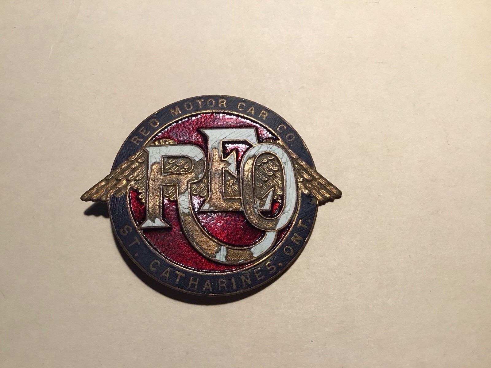 Original 1910 REO Downwing Automobile emblem Canadian version Original 1910 REO Downwing Automobile emblem Canadian version
