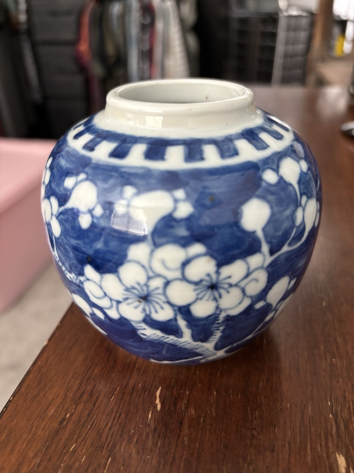 Vintage blue and white porcelain jar featuring a classic prunus blossom design.