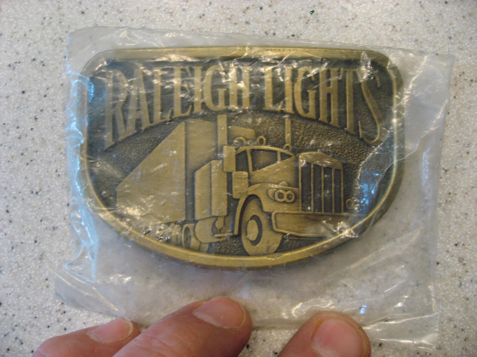 Vintage Solid Brass Raleigh Lights Trucker Belt Buckle - New in Sealed Bag