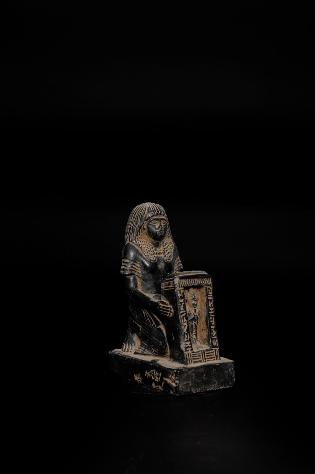 Scribe Statue ancient Egyptian seated writer with papyrus scroll, Pharaonic reli