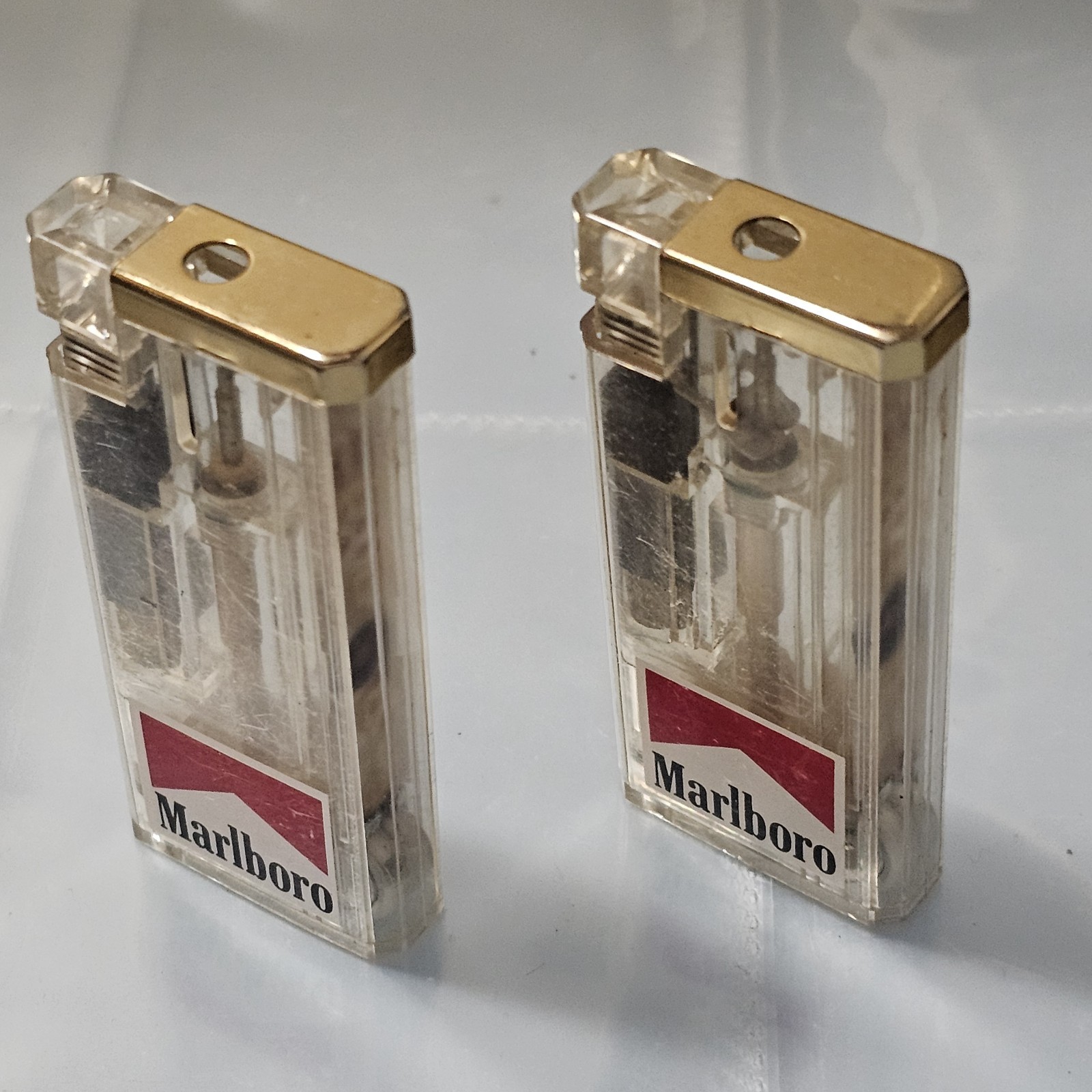 CLEAR MARLBORO CIGARETTE LIGHT UP LIGHTERS X2 Rare CLEAR MARLBORO CIGARETTE LIGHT UP LIGHTERS X2 Rare