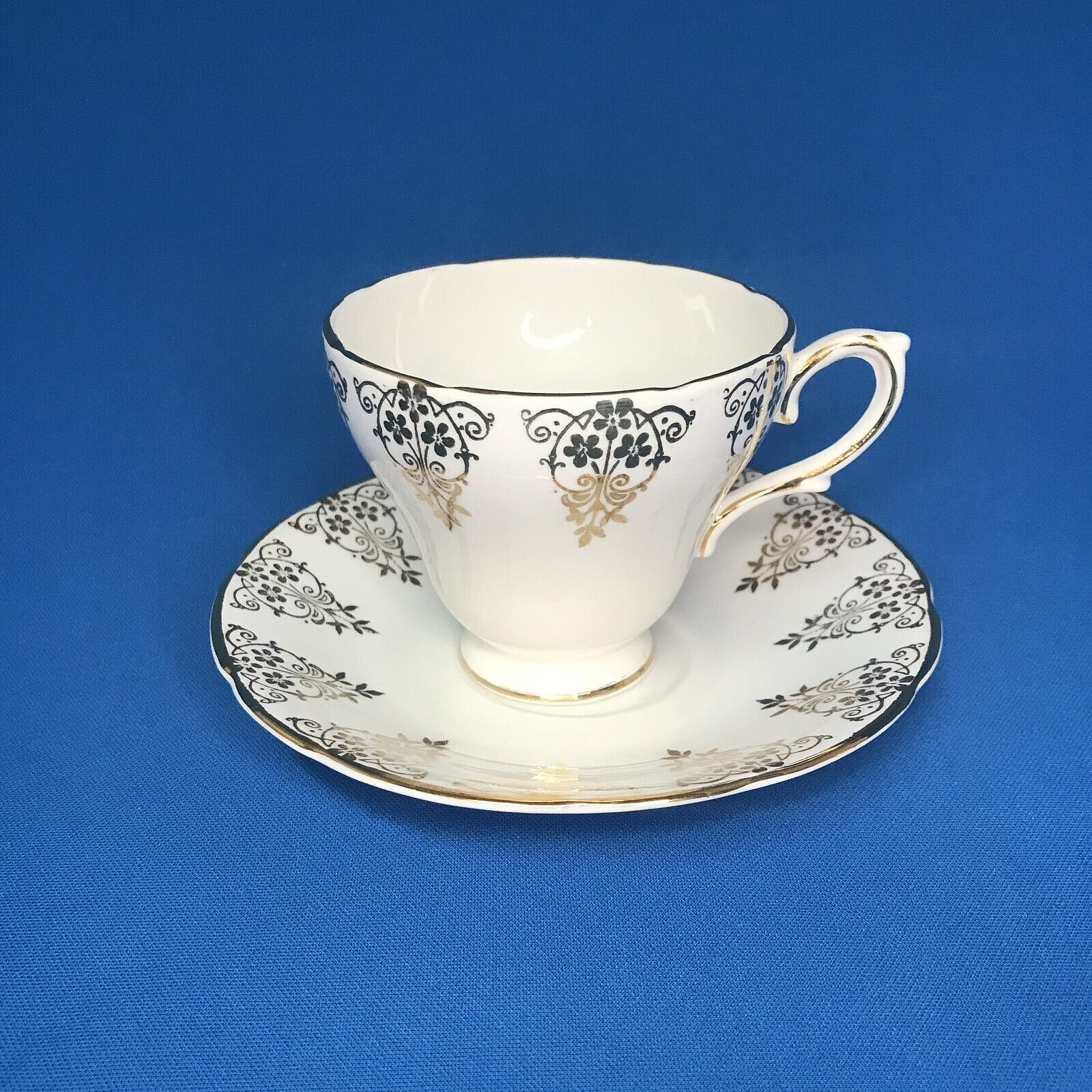 Vintage Delphine Bone China White & Gold Gilt Teacup and Saucer Made In England