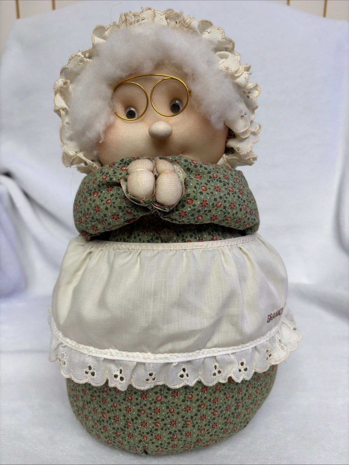 vintage soft-sculpture grandma doll featuring a green floral outfit