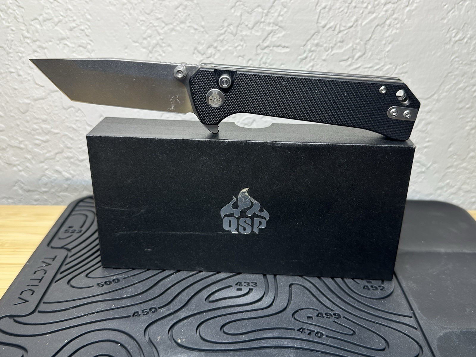 QSP Grebe Pocketknife Tanto Plain Edge SS Blade Black G10 Handle Button Lock