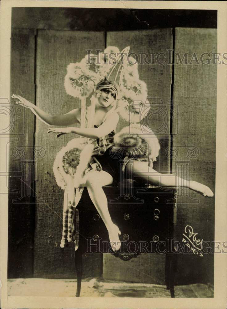 1924 Press Photo Dancer Lily Wilmer Poses in Costume on Top of Dresser